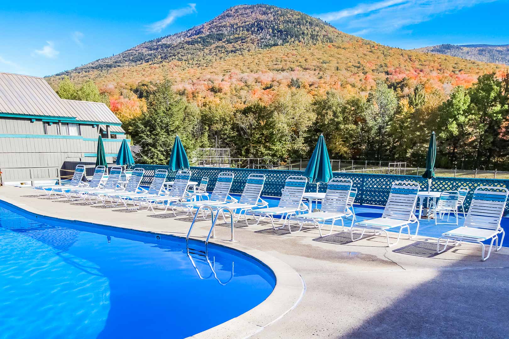 A spacious outdoor swimming pool at VRI's Village of Loon Mountain in New Hampshire.